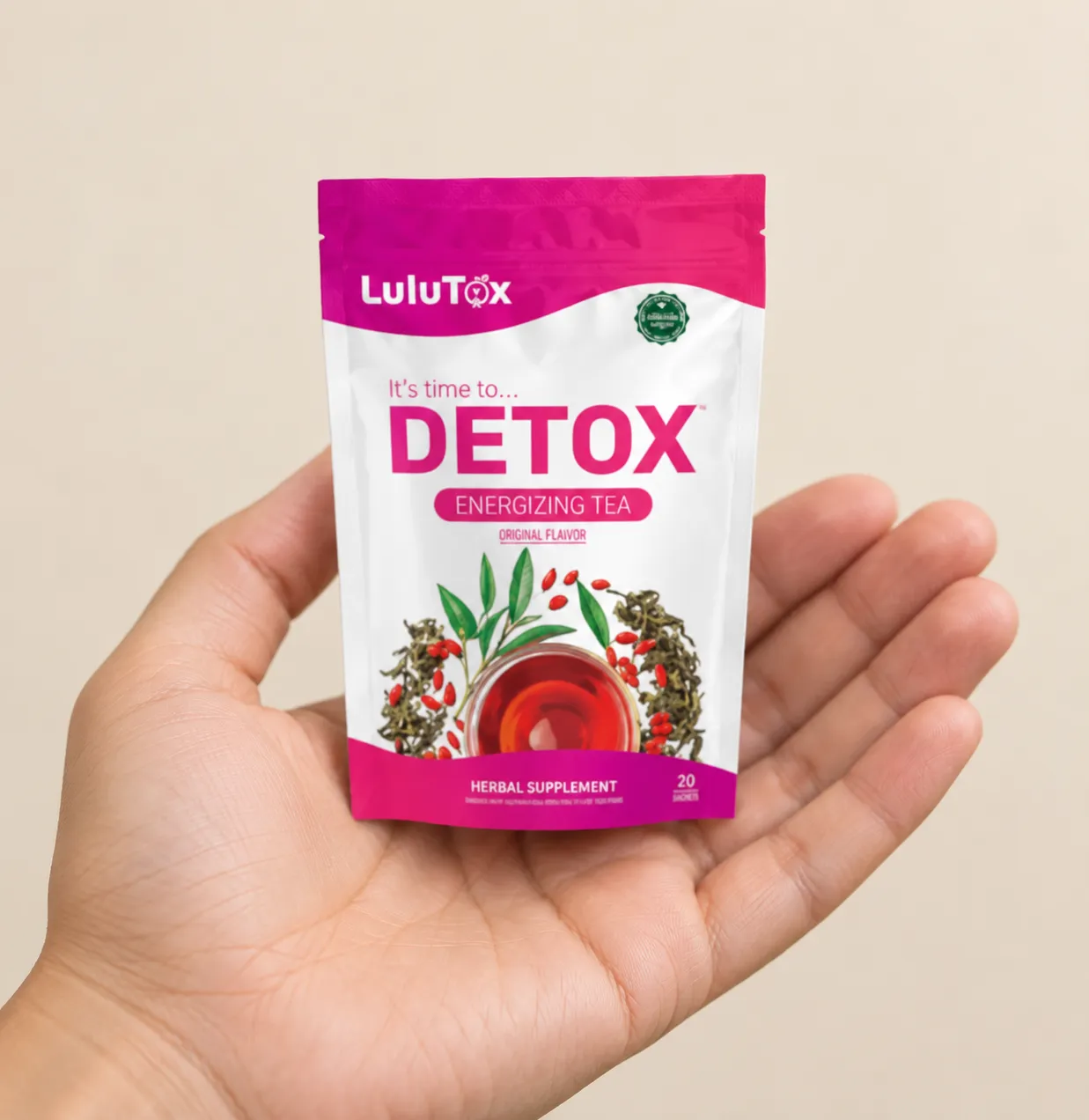 Lulutox Detox Tea — the package held in a hand