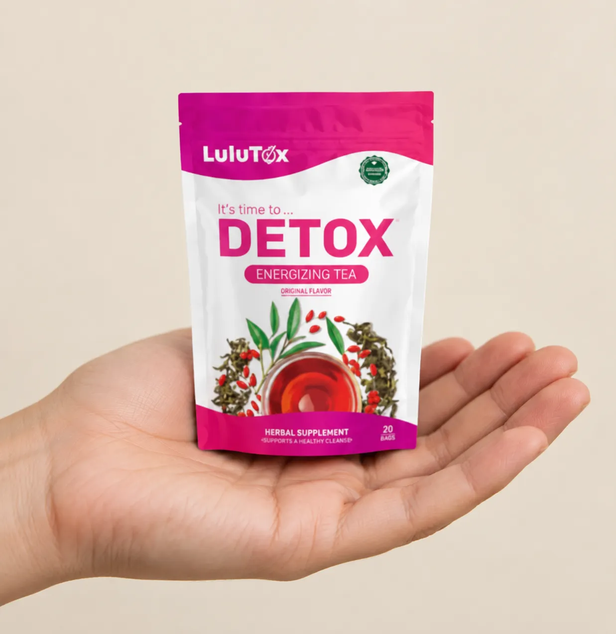 Lulutox Detox Tea HCTC — the package held in a hand